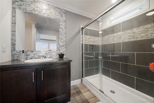 539 W 9th St, Akron, CO 80720 - full bath with ornamental molding, vanity, a shower stall, and decorative backsplash