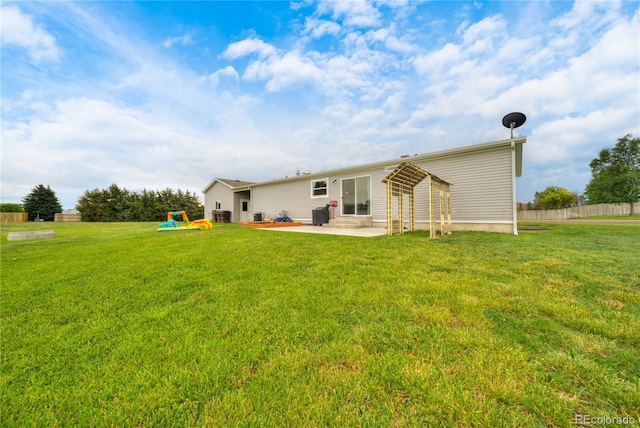 539 W 9th St, Akron, CO 80720 - rear view of property with a patio area, entry steps, and a lawn