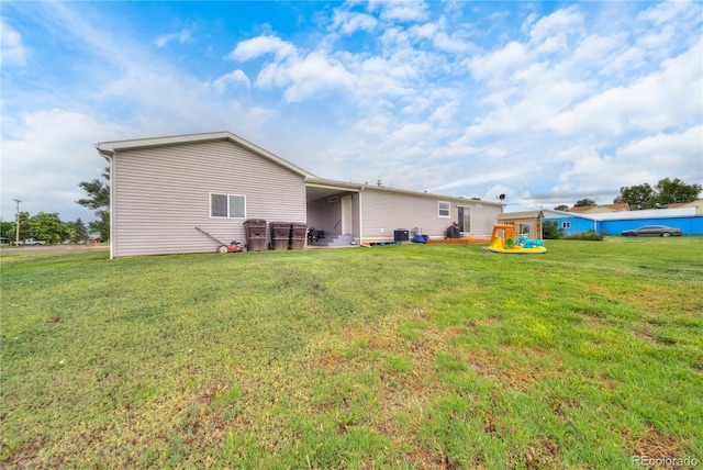 539 W 9th St, Akron, CO 80720 - back of house with a lawn