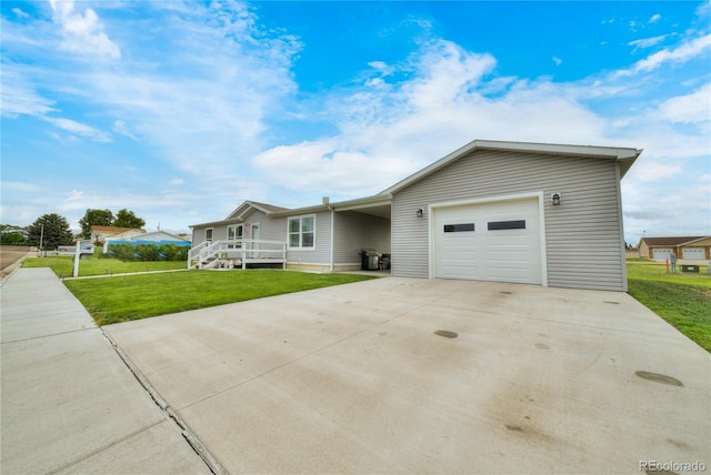 539 W 9th St, Akron, CO 80720 - single story home featuring a front yard, concrete driveway, and an attached garage
