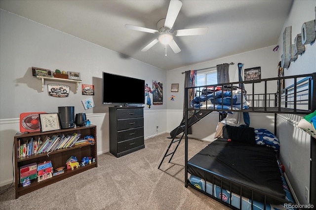 carpeted bedroom with a ceiling fan