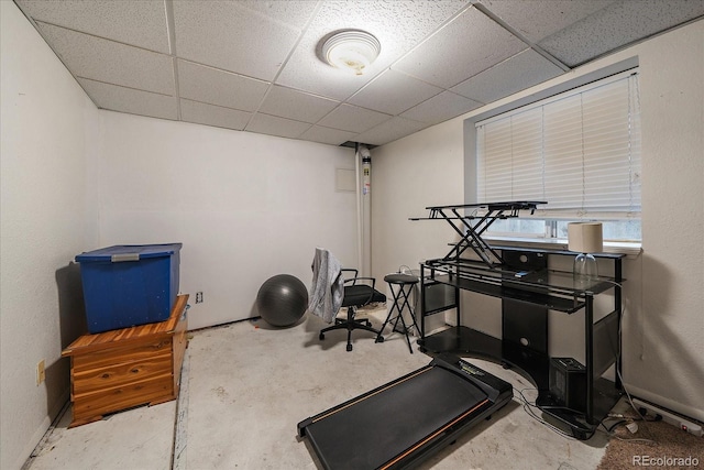 exercise room featuring a paneled ceiling