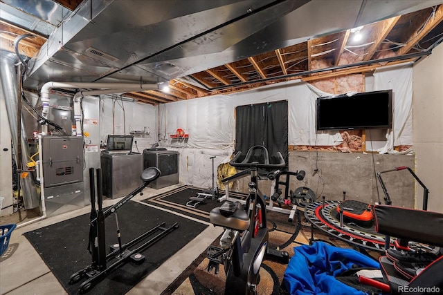 exercise area with separate washer and dryer and visible vents