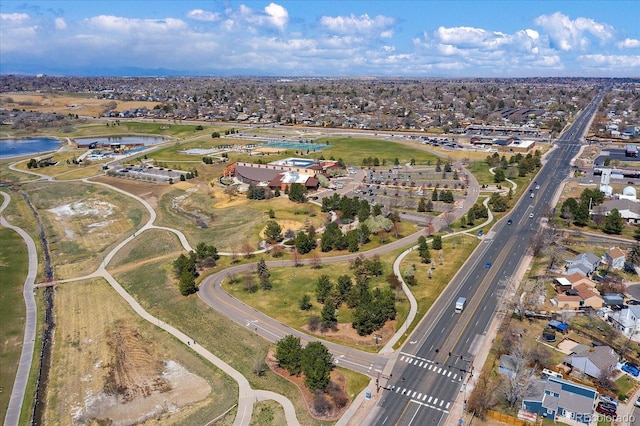 drone / aerial view with a water view and a residential view