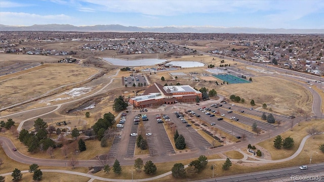 birds eye view of property featuring a mountain view