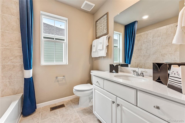 3331 N Buchanan Way, Aurora, CO 80019 - bathroom featuring vanity, toilet, baseboards, and visible vents