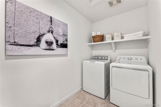 3331 N Buchanan Way, Aurora, CO 80019 - laundry area with laundry area, washer and clothes dryer, visible vents, baseboards, and light tile patterned flooring