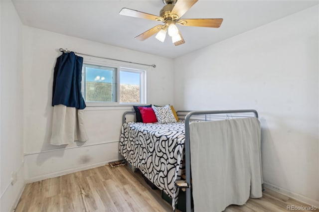 bedroom featuring ceiling fan and light hardwood / wood-style floors