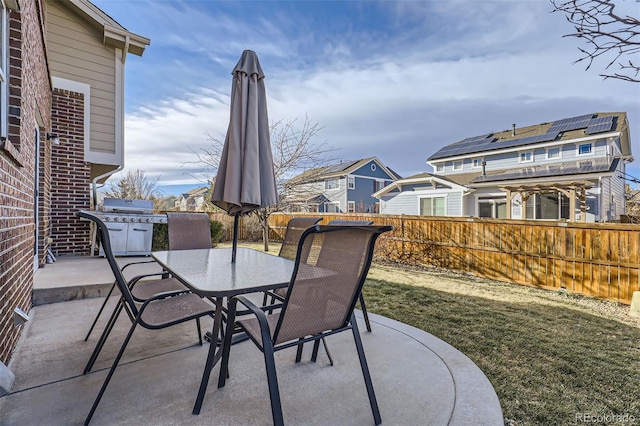 view of patio featuring a grill