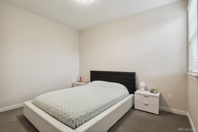 11151 W 53rd Dr, Wheat Ridge, CO 80033 - bedroom with dark carpet and baseboards