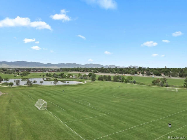 11151 W 53rd Dr, Wheat Ridge, CO 80033 - view of home's community with an area for sports and a water and mountain view