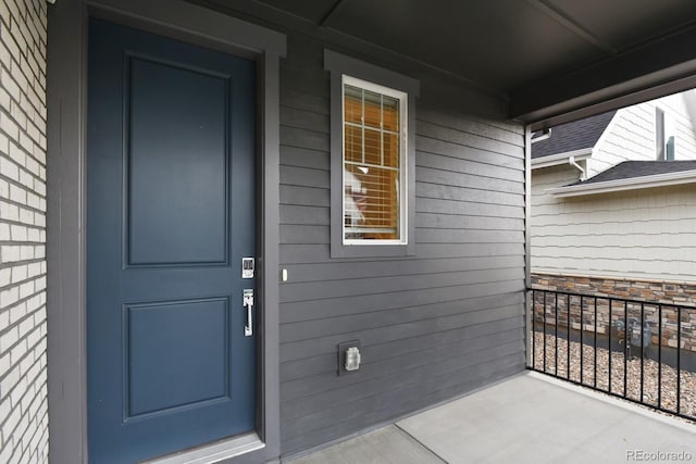 11151 W 53rd Dr, Wheat Ridge, CO 80033 - view of exterior entry with a porch