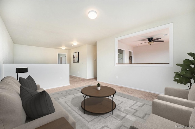 living area with carpet and baseboards