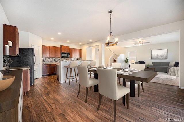 dining room featuring ceiling fan, stairway, dark wood-style flooring, and recessed lighting