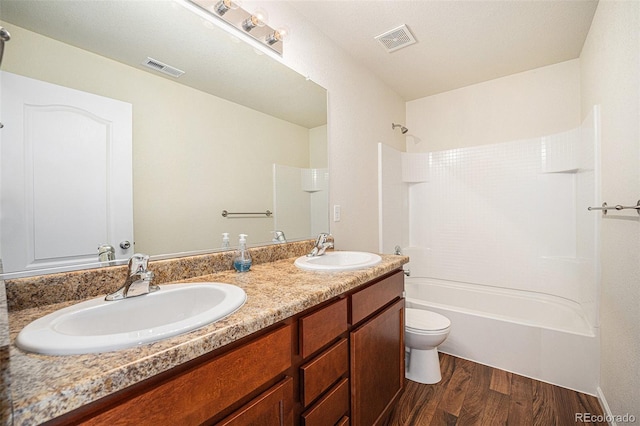 1788 Taos St, Brighton, CO 80603 - full bathroom with wood finished floors, double vanity, toilet, and shower / bath combination