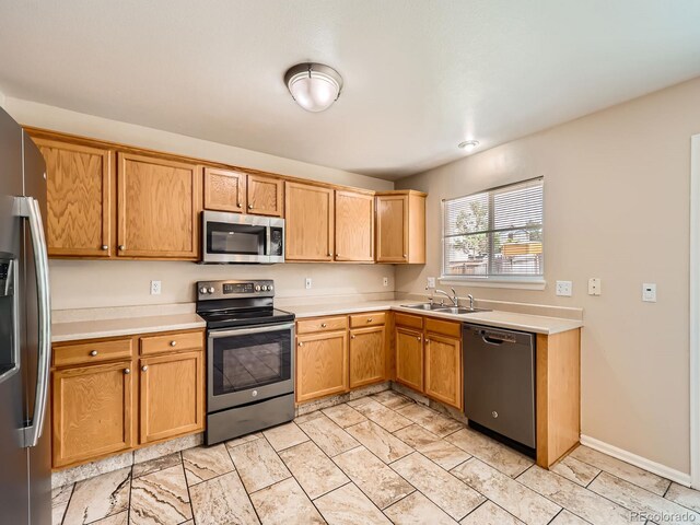 3708 S Lisbon Way, Aurora, CO 80013 - kitchen featuring stainless steel appliances and light countertops