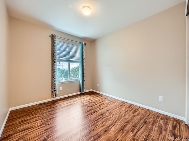 3708 S Lisbon Way, Aurora, CO 80013 - spare room with wood finished floors and baseboards
