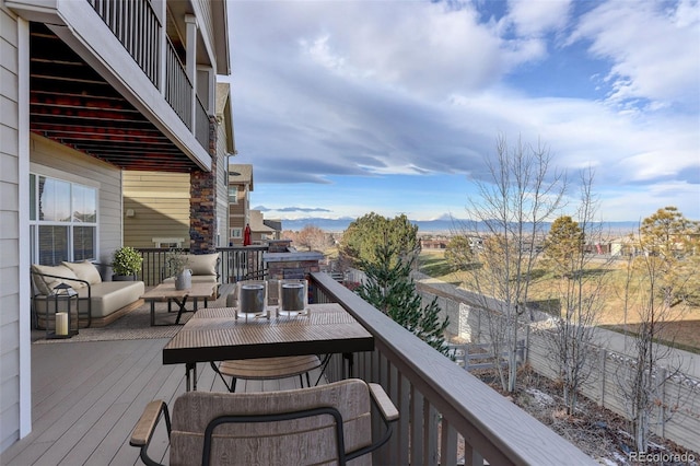 balcony with a mountain view and an outdoor hangout area