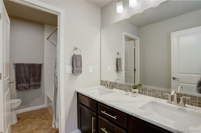 full bathroom with tile patterned flooring, tasteful backsplash, vanity, toilet, and shower / bath combo with shower curtain