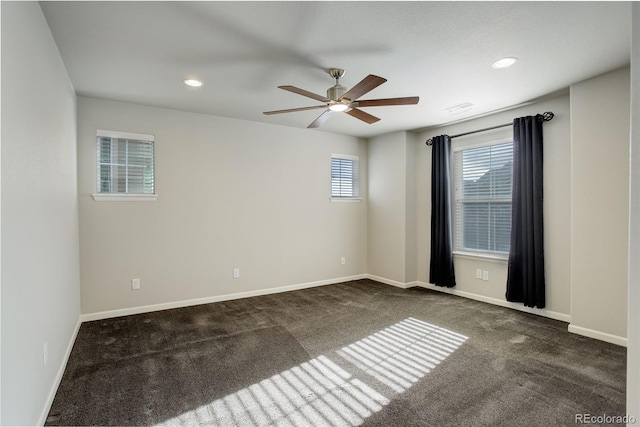 carpeted empty room with ceiling fan