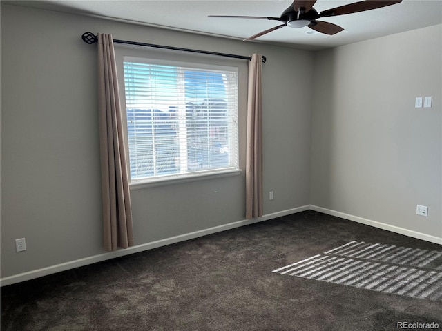 carpeted empty room featuring ceiling fan