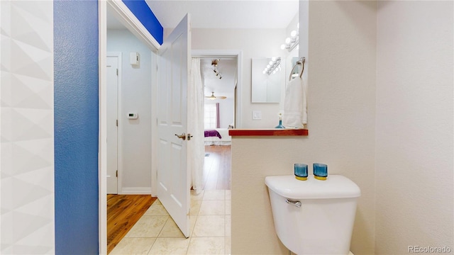 bathroom featuring tile patterned flooring and toilet