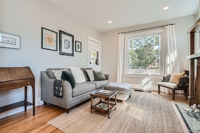 493 S Lincoln St, Denver, CO 80209 - living area featuring recessed lighting, baseboards, visible vents, and light wood-type flooring