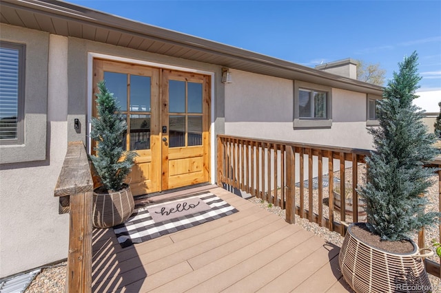 11170 Peaceful Valley Rd, Colorado Springs, CO 80925 - doorway to property with french doors, stucco siding, and a deck