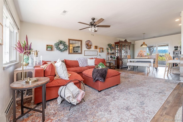 11170 Peaceful Valley Rd, Colorado Springs, CO 80925 - living area with baseboard heating, a ceiling fan, wood finished floors, and recessed lighting