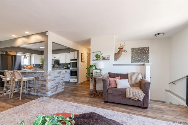 11170 Peaceful Valley Rd, Colorado Springs, CO 80925 - living area with wood finished floors and recessed lighting