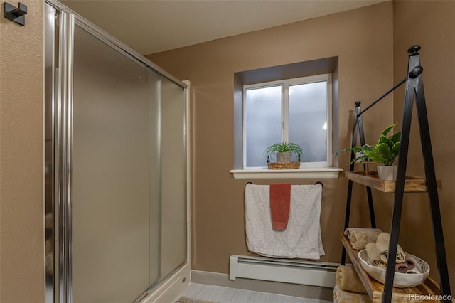11170 Peaceful Valley Rd, Colorado Springs, CO 80925 - bathroom featuring baseboard heating and a shower stall
