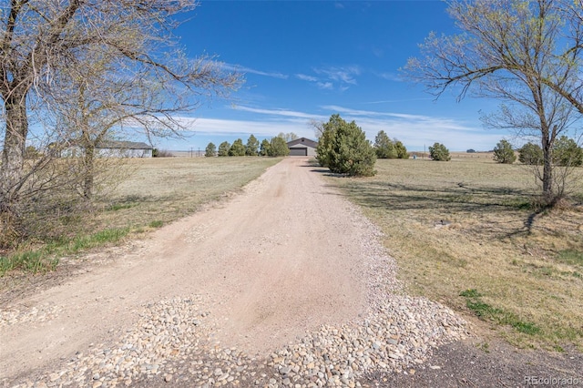 11170 Peaceful Valley Rd, Colorado Springs, CO 80925 - view of dirt / gravel driveway with a rural view