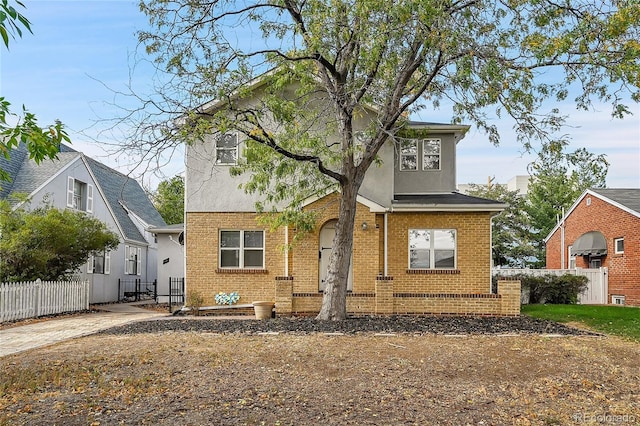 1431 Tamarac St, Denver, CO 80220 - view of front of home featuring stucco siding, brick siding, and fence