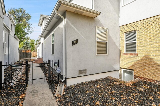 1431 Tamarac St, Denver, CO 80220 - exterior space with stucco siding, a gate, and fence