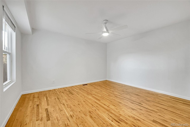 spare room featuring ceiling fan and light wood-type flooring