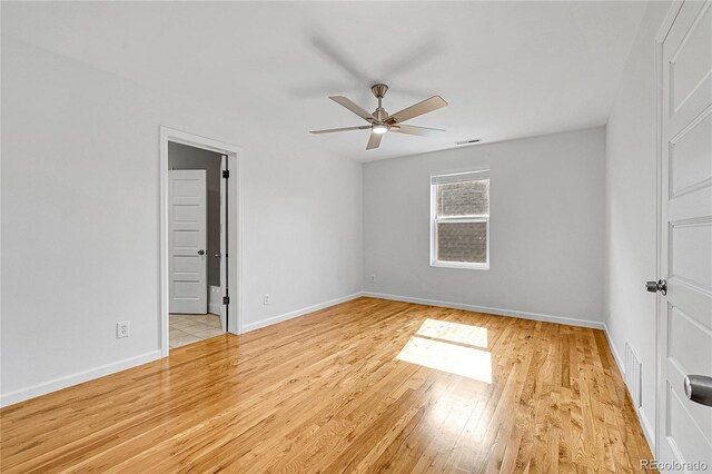 1431 Tamarac St, Denver, CO 80220 - unfurnished bedroom featuring ensuite bath, visible vents, a ceiling fan, baseboards, and light wood-style floors