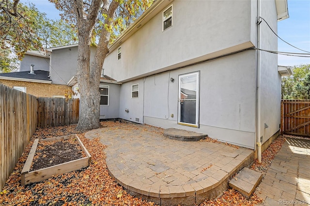 rear view of house with a patio