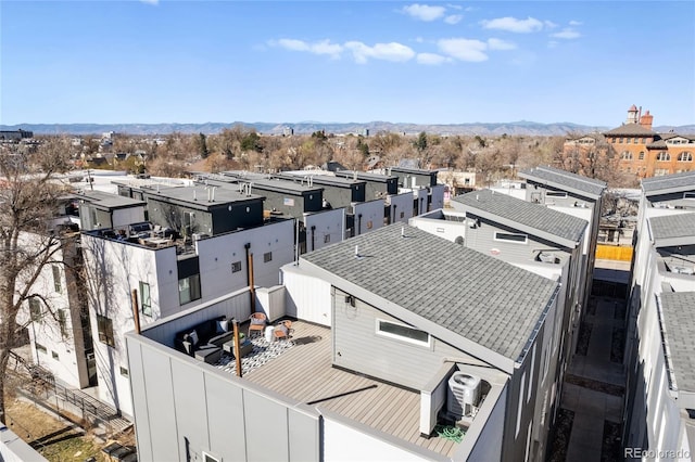 birds eye view of property featuring a mountain view
