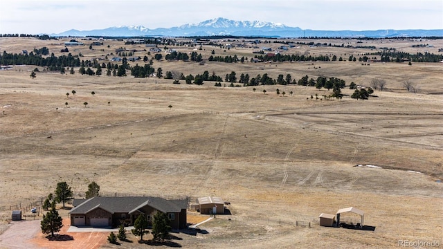 birds eye view of property with a rural view and a mountain view