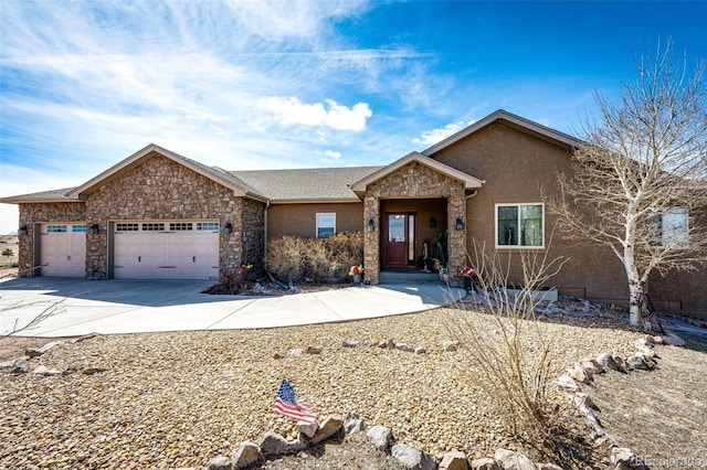 ranch-style house featuring stucco siding, stone siding, concrete driveway, and an attached garage