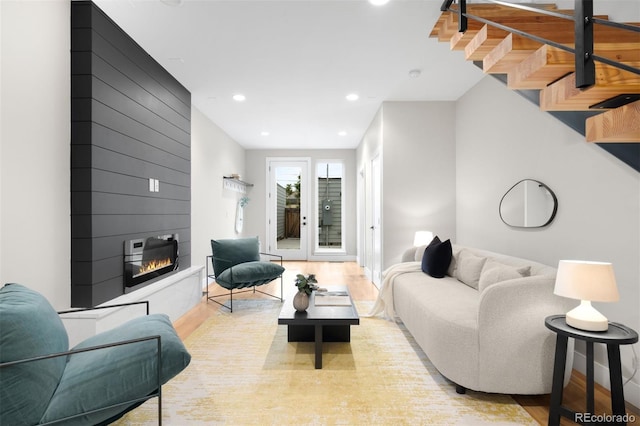 2179 S Bannock St, Denver, CO 80223 - living area featuring wood finished floors, a fireplace, and recessed lighting