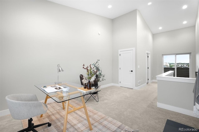 2179 S Bannock St, Denver, CO 80223 - home office with light carpet, baseboards, a towering ceiling, and recessed lighting