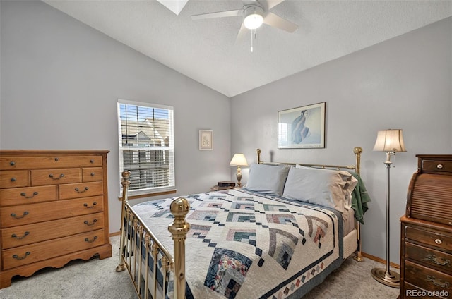 carpeted bedroom with baseboards, lofted ceiling, and ceiling fan