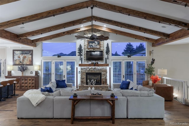 living room with hardwood / wood-style floors, a fireplace, beamed ceiling, and high vaulted ceiling