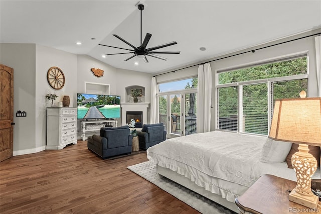 bedroom featuring hardwood / wood-style floors, ceiling fan, and lofted ceiling