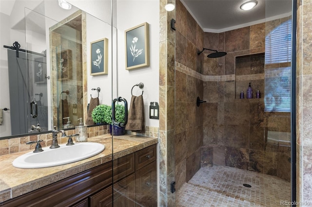 bathroom with vanity and an enclosed shower