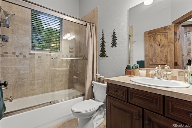 full bathroom with shower / bath combination with glass door, toilet, and vanity