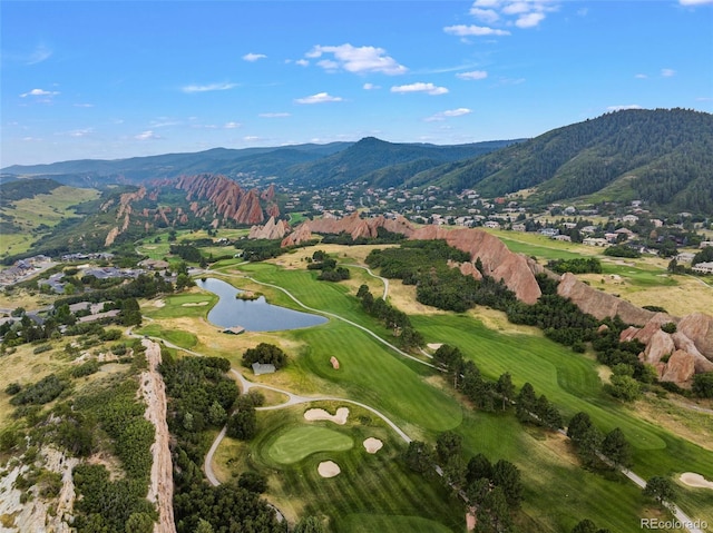 birds eye view of property featuring a water and mountain view