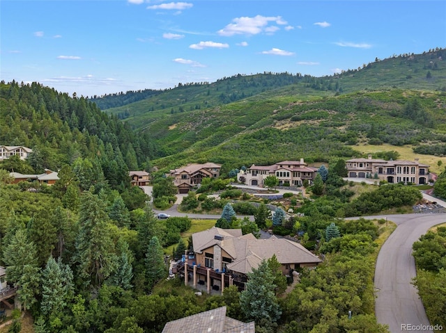 birds eye view of property with a mountain view