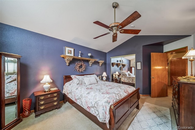 bedroom with vaulted ceiling, light carpet, baseboards, and a ceiling fan